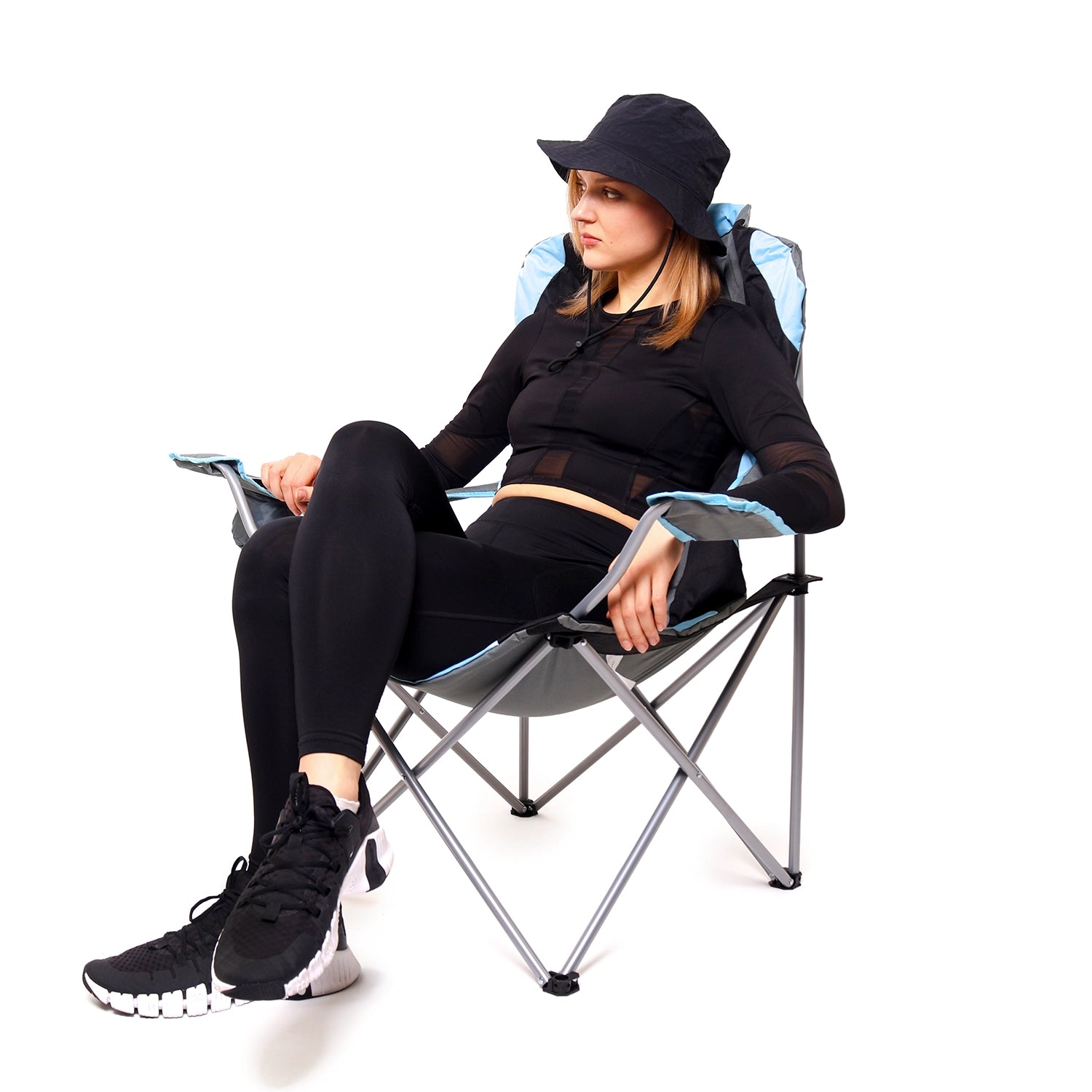 Camping chair with bottle holder on armrest