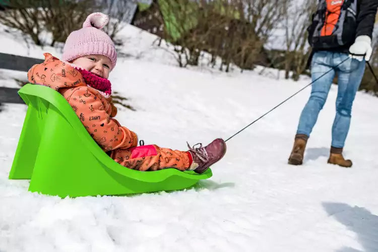 Baby sled with safety harness and pull rope