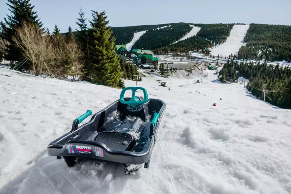 Designer sled with steering wheel