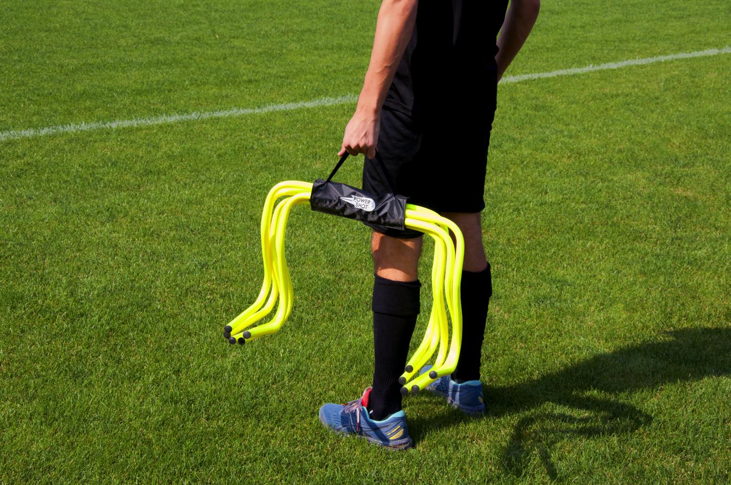 Carrying handle for hurdles and slalom poles