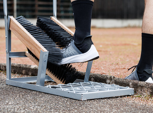 Shoe brush for sports fields with support handle