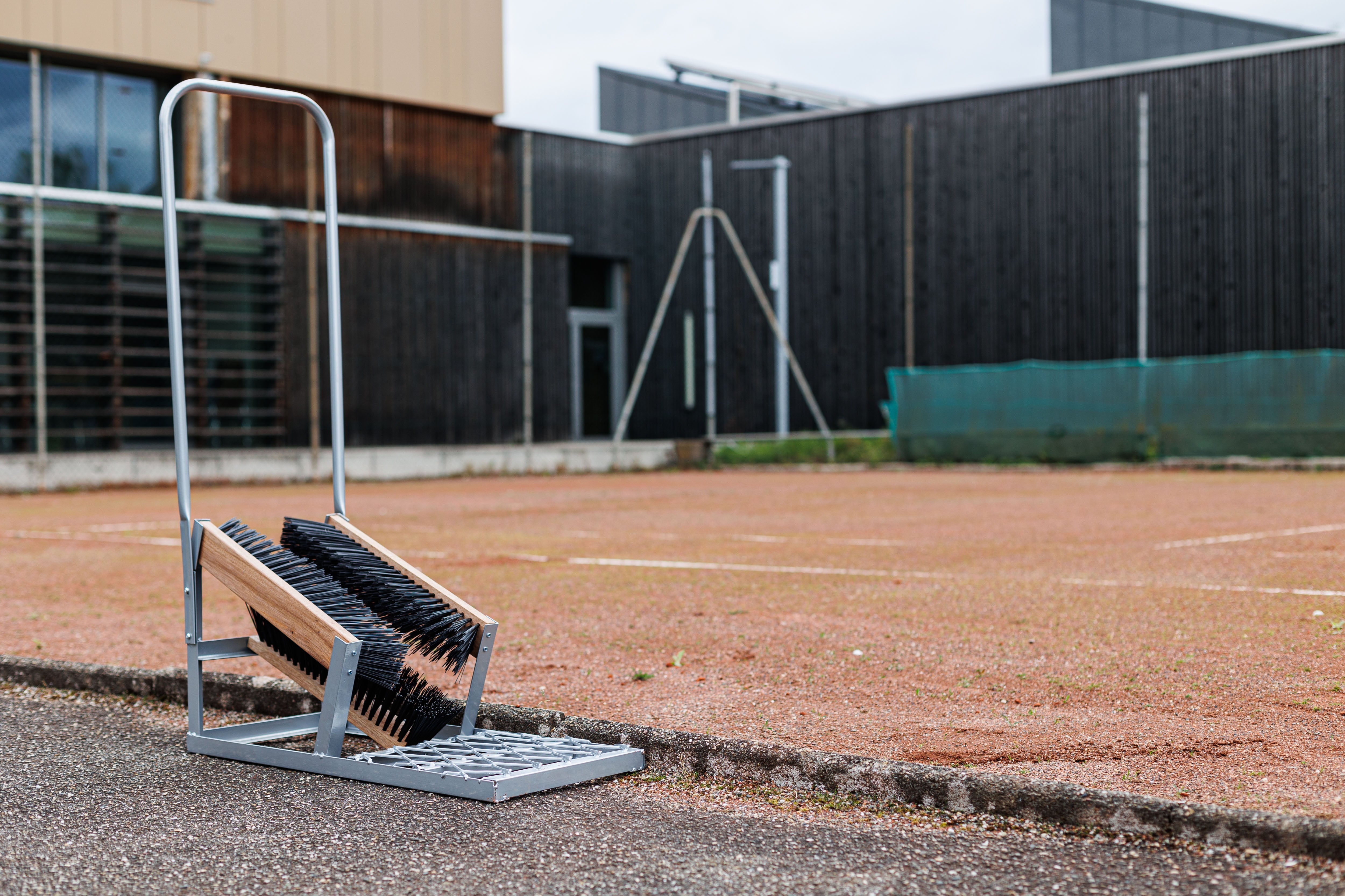 Shoe brush for sports fields with support handle